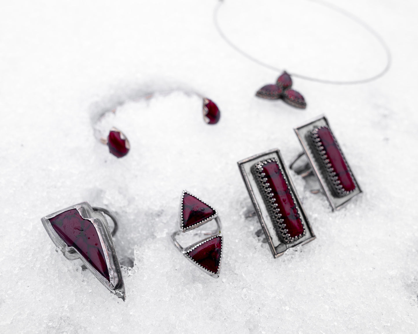 Features entire collection of bloody bison jewelry on the snow