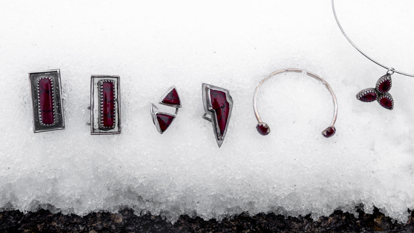 Features entire collection of bloody bison jewelry on the snow